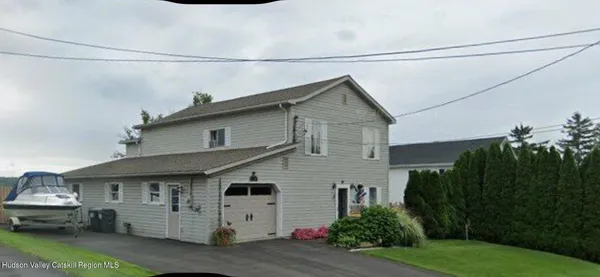 a view of a house with backyard