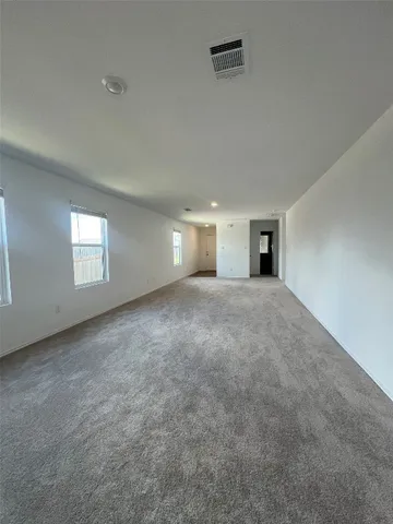 a bathroom with a toilet and a bathtub
