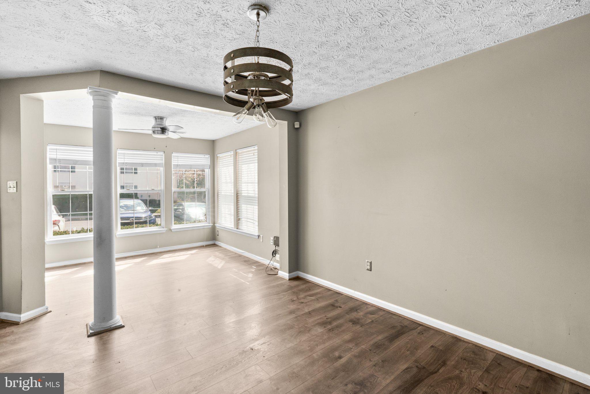 4840 Shellbark Road, Unit 4840 Owings Mills, MD 21117 - Photo 12 of 47 a view of a room with a chandelier