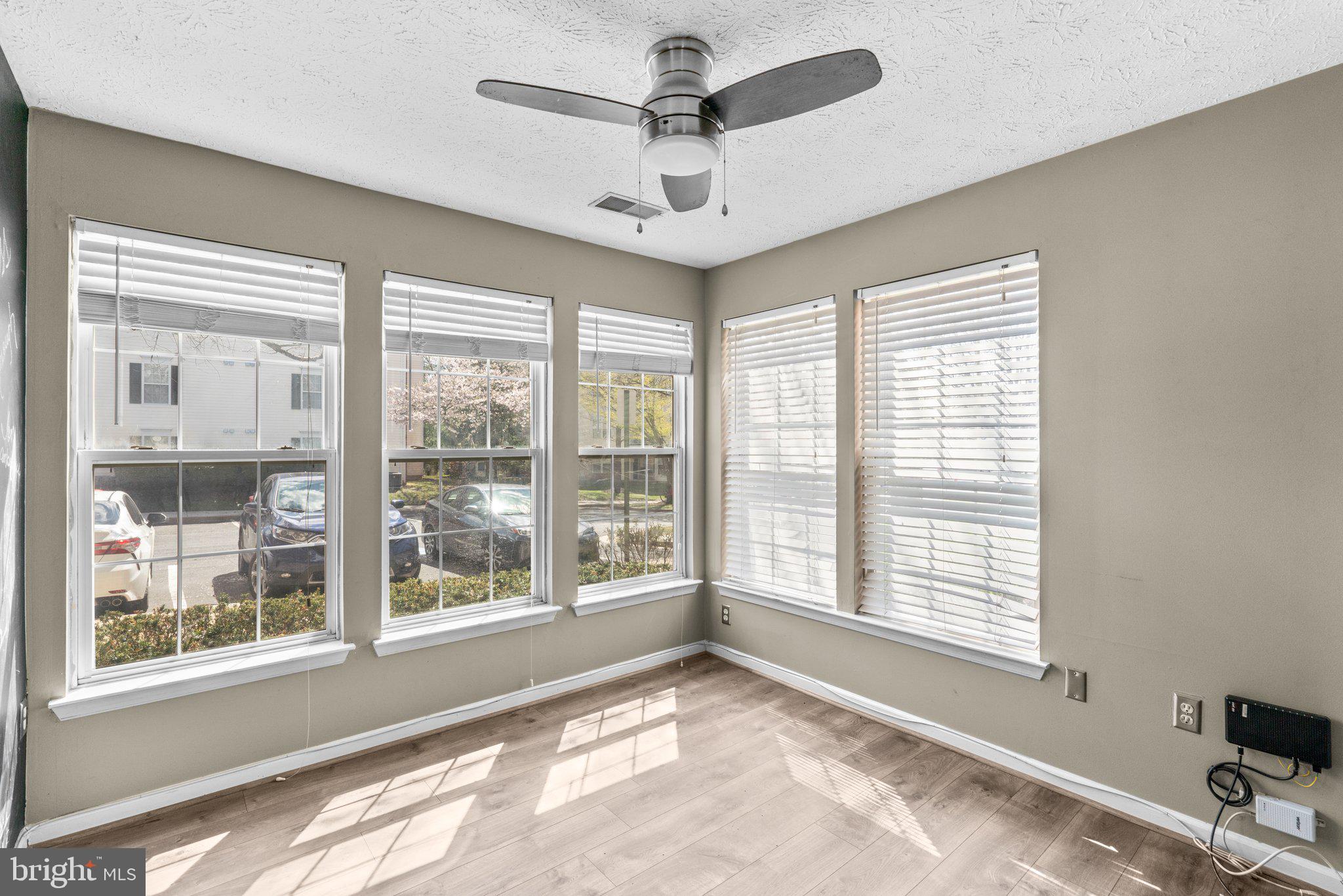4840 Shellbark Road, Unit 4840 Owings Mills, MD 21117 - Photo 17 of 47 a view of a livingroom with a window and a ceiling fan