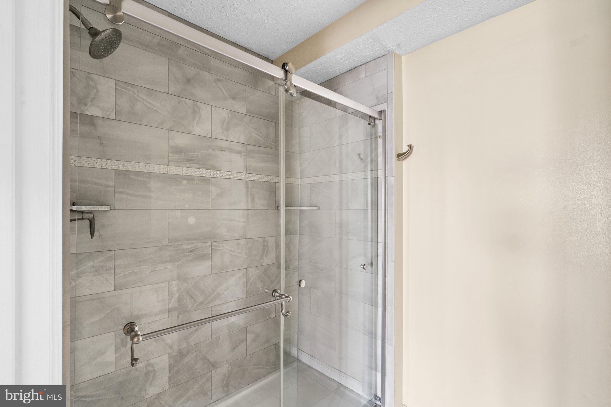 4840 Shellbark Road, Unit 4840 Owings Mills, MD 21117 - Photo 36 of 47 a bathroom with a glass shower door