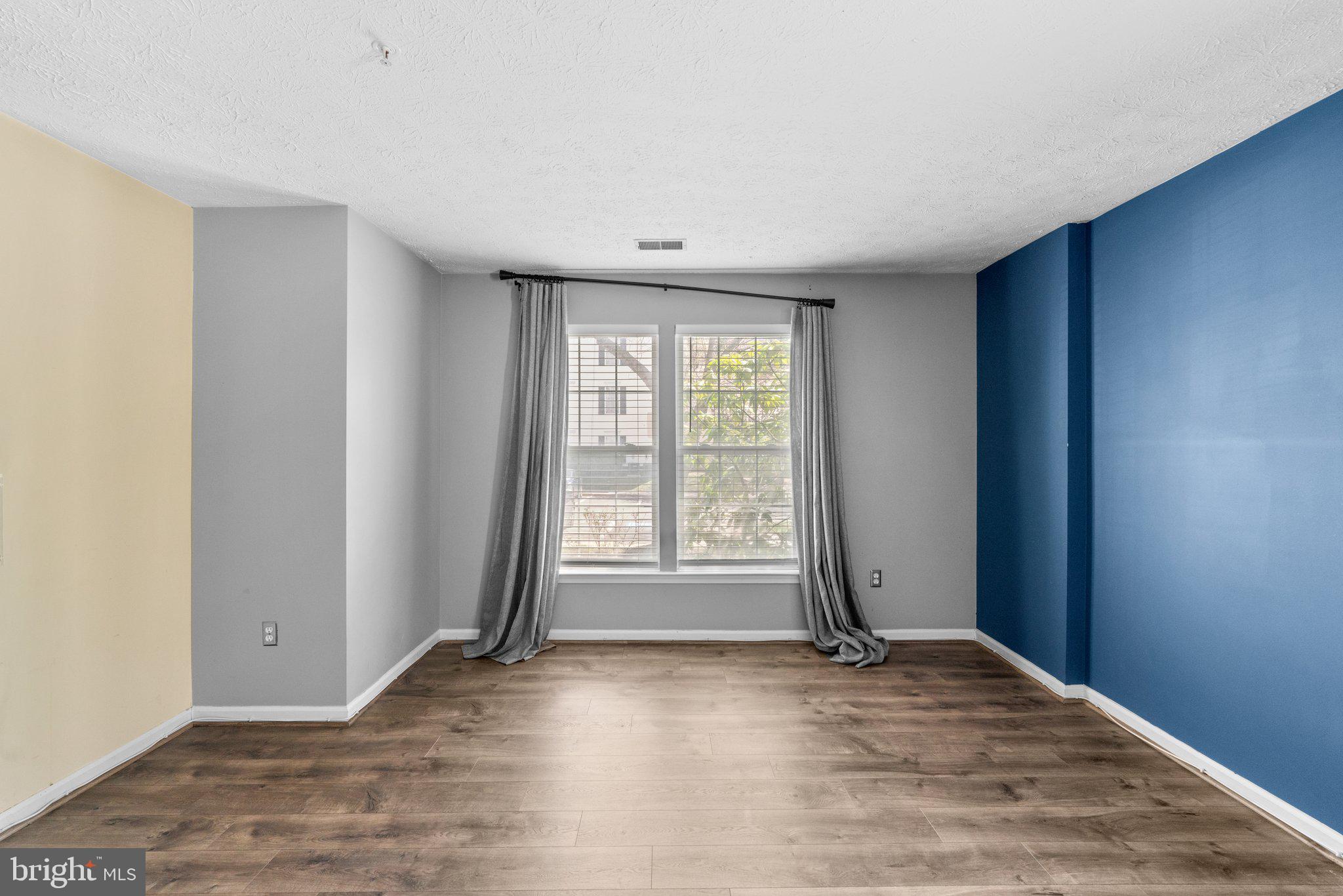 4840 Shellbark Road, Unit 4840 Owings Mills, MD 21117 - Photo 37 of 47 an empty room with wooden floor and windows