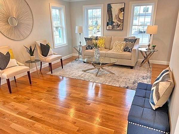 2 Pelissier Circle Randolph, MA 02368 - Photo 15 of 29 a living room with fireplace furniture and a large window