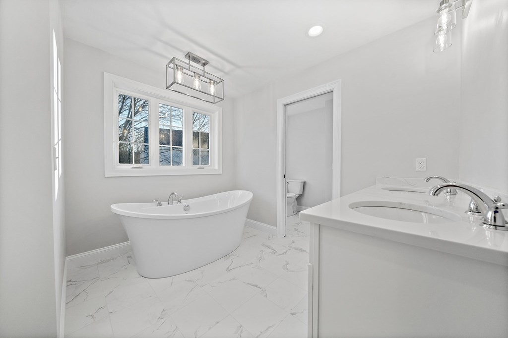2 Pelissier Circle Randolph, MA 02368 - Photo 17 of 29 a bathroom with a sink and a bathtub