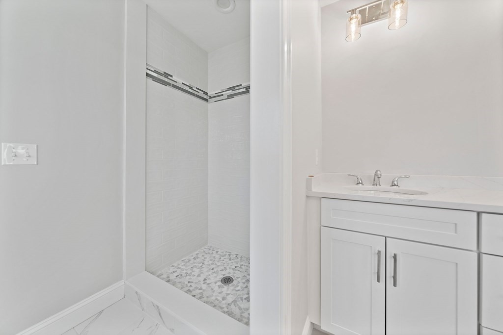 2 Pelissier Circle Randolph, MA 02368 - Photo 18 of 29 a bathroom with a sink and vanity