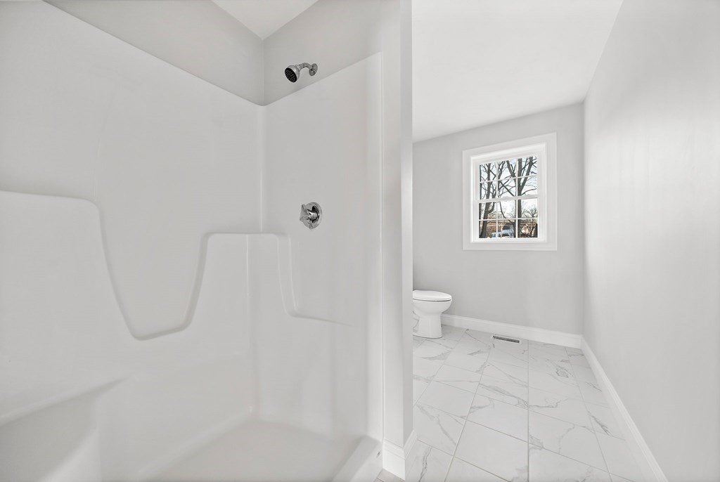 2 Pelissier Circle Randolph, MA 02368 - Photo 22 of 29 a bathroom with a white bath tub and a shower