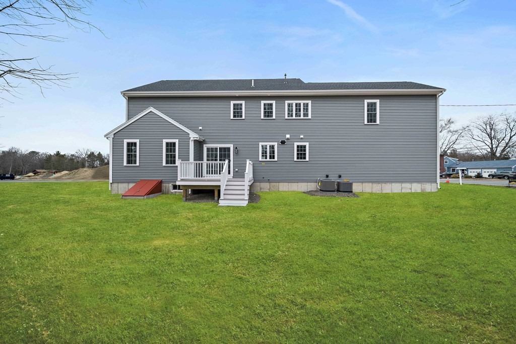2 Pelissier Circle Randolph, MA 02368 - Photo 29 of 29 a front view of house with yard and green space