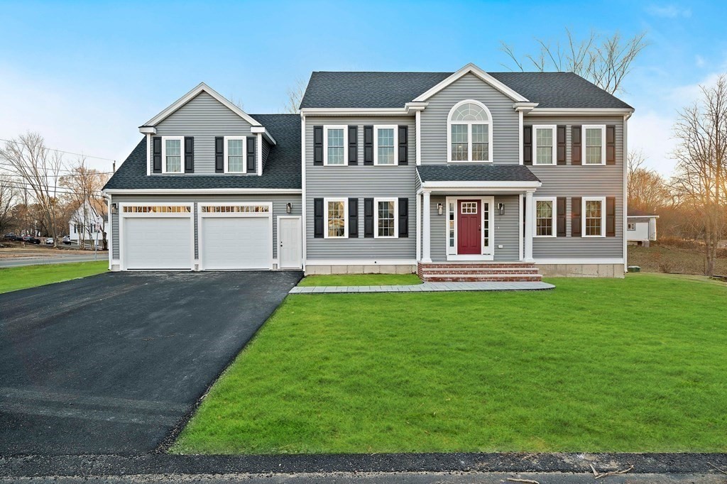 2 Pelissier Circle Randolph, MA 02368 - Photo 3 of 29 a front view of a house with a yard