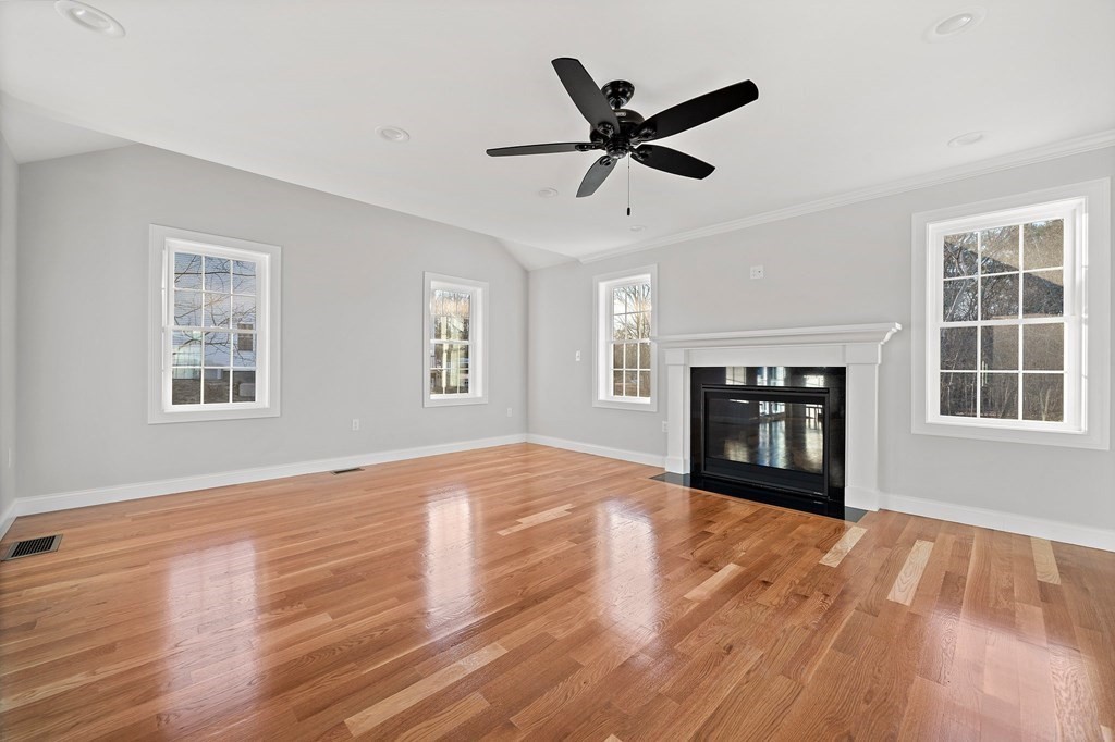 2 Pelissier Circle Randolph, MA 02368 - Photo 6 of 29 a view of empty room with wooden floor and fan