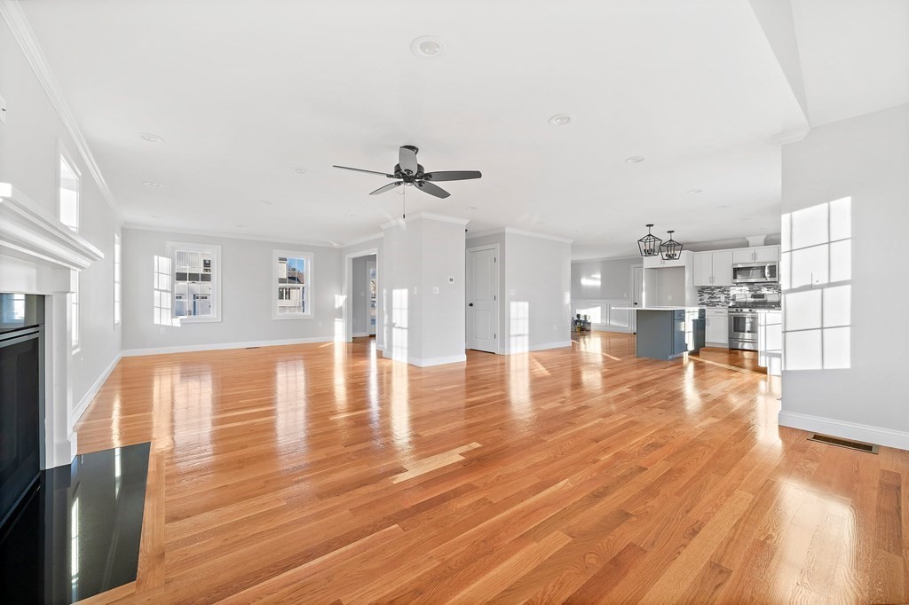 2 Pelissier Circle Randolph, MA 02368 - Photo 7 of 29 a view of a living room with hardwood floor and a view of kitchen