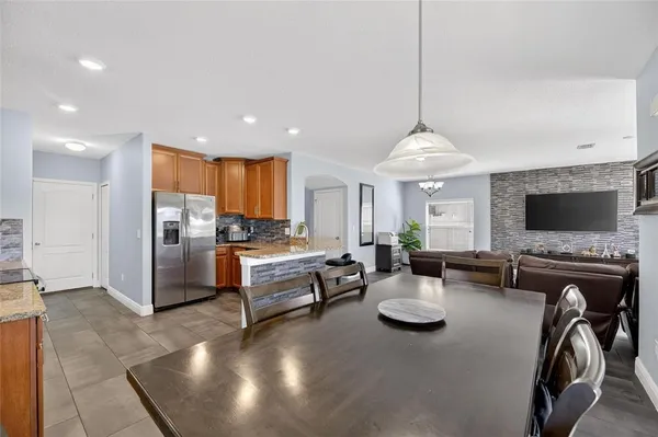 a kitchen with stainless steel appliances granite countertop a stove oven and a refrigerator