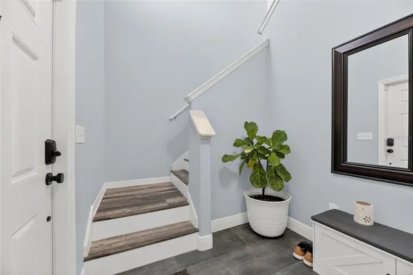 a bedroom with a bed and a lamp on table