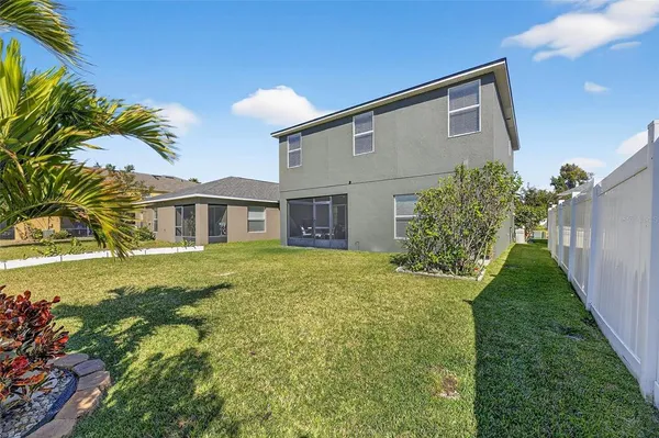 an aerial view of a house with a garden and swimming pool