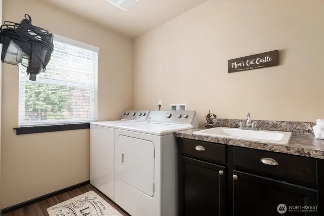 a utility room with dryer and washer