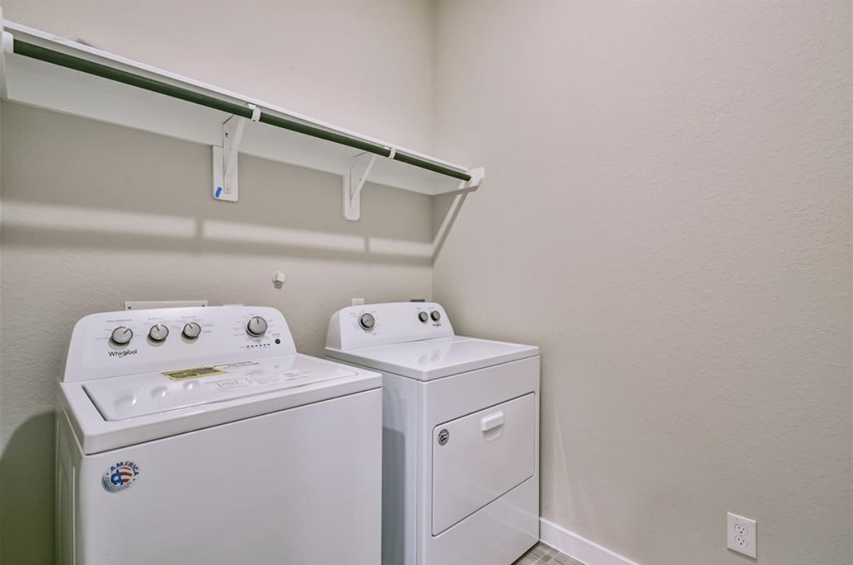 10005 Red Beadtree Place Conroe, TX 77385 - Photo 20 of 29 a utility room with dryer and washer