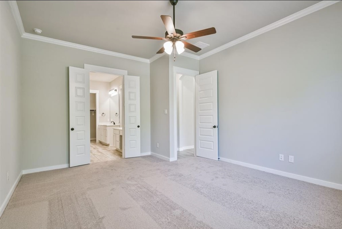 10005 Red Beadtree Place Conroe, TX 77385 - Photo 22 of 29 a view of a livingroom with a ceiling fan and window