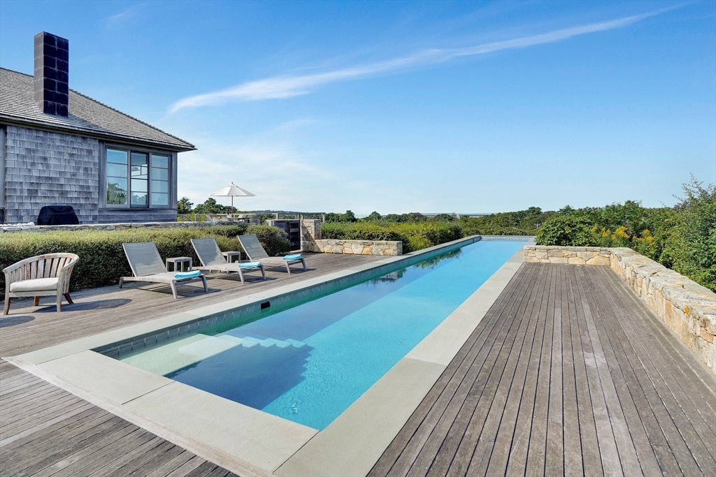 2 Squibnocket Road Chilmark, MA 02535 - Photo 11 of 42 a view of a terrace with chairs