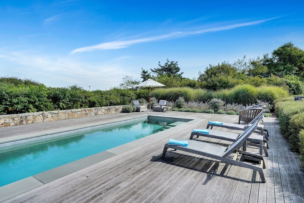 2 Squibnocket Road Chilmark, MA 02535 - Photo 13 of 42 a view of a terrace with chairs