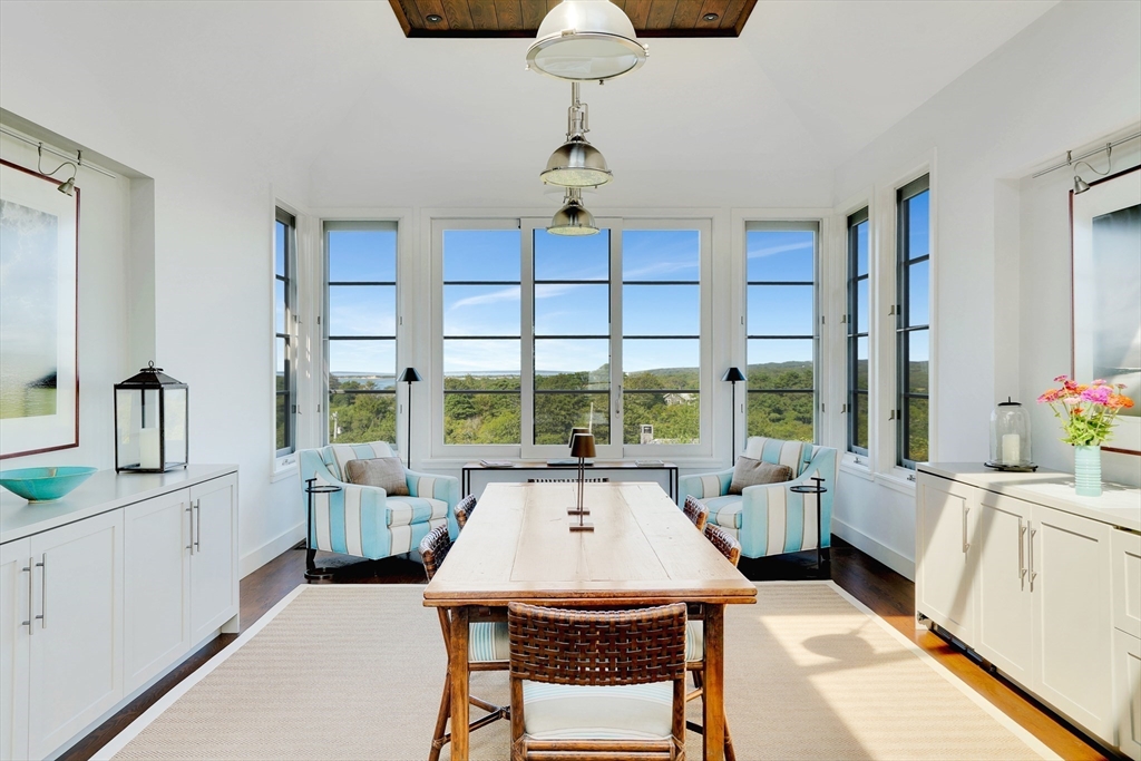 2 Squibnocket Road Chilmark, MA 02535 - Photo 16 of 42 a very nice looking room with a large window a table and chairs