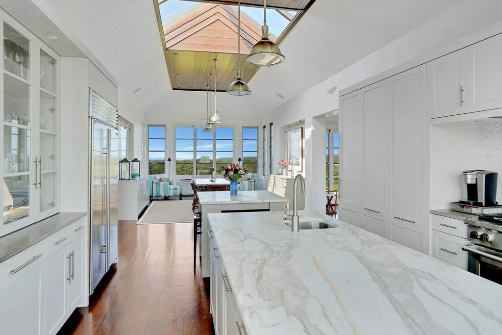 2 Squibnocket Road Chilmark, MA 02535 - Photo 18 of 42 a view of a kitchen with kitchen island stainless steel appliances refrigerator stove microwave and cabinets