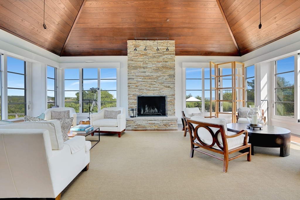 2 Squibnocket Road Chilmark, MA 02535 - Photo 22 of 42 a living room with furniture and a fireplace