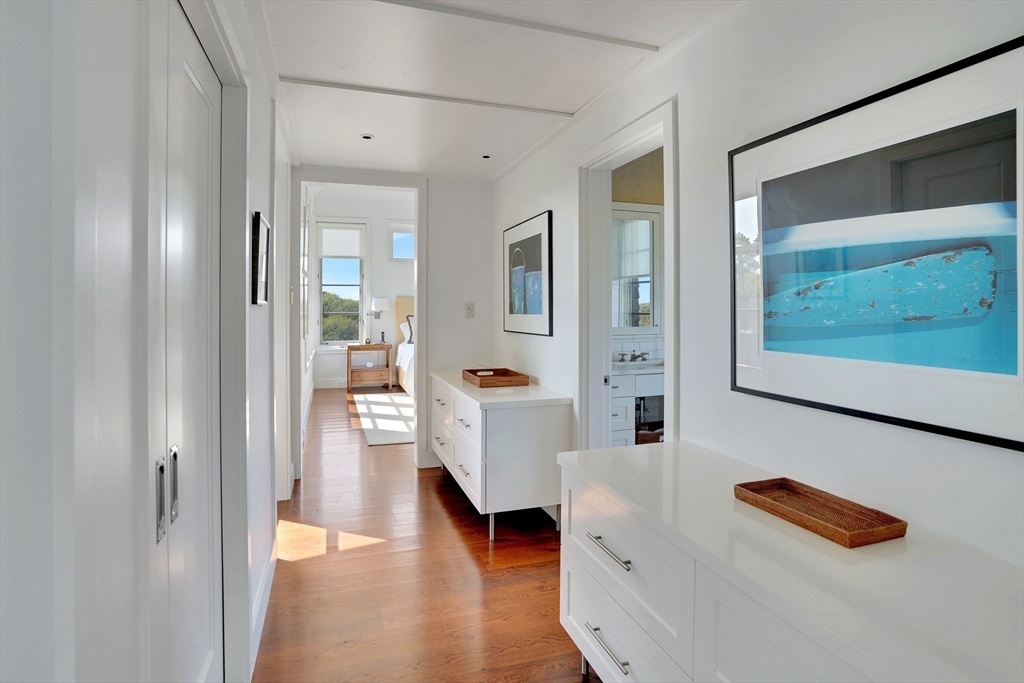 2 Squibnocket Road Chilmark, MA 02535 - Photo 28 of 42 a hallway with wooden floor and furniture