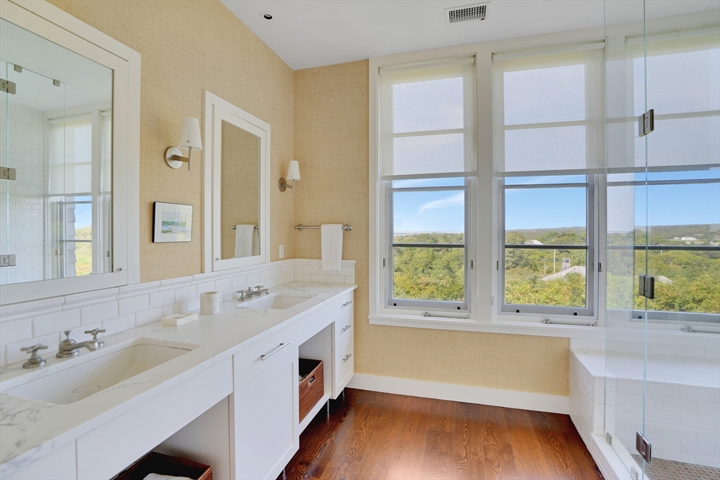 2 Squibnocket Road Chilmark, MA 02535 - Photo 29 of 42 a bathroom with a sink and a large mirror