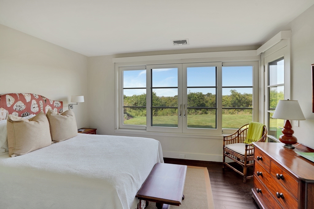 2 Squibnocket Road Chilmark, MA 02535 - Photo 36 of 42 a bedroom with a bed and a large window