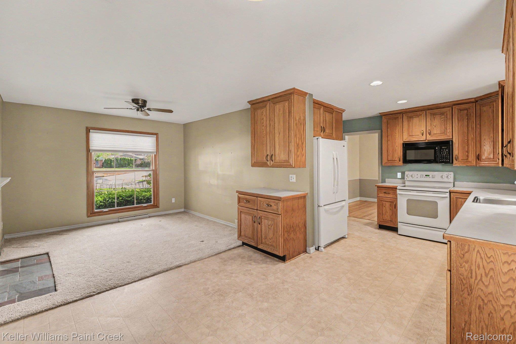 914 Croydon Road Rochester, MI 48309 - Photo 7 of 24 Open to the kitchen, the family room centers around a natural fireplace with a brick hearth.