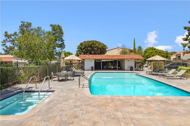 a view of a swimming pool with lounge chairs