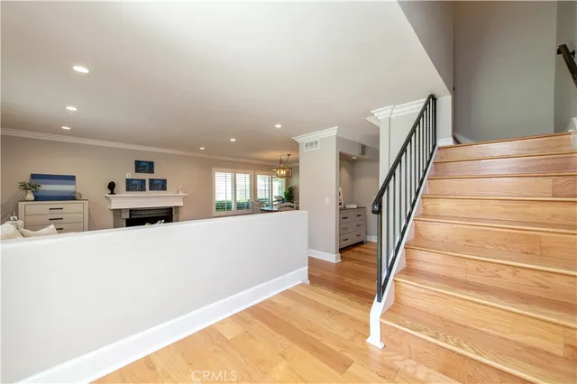 a view of a kitchen with furniture and stairs