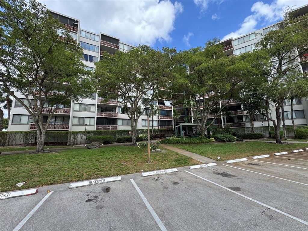 4222 Inverrary Boulevard, Unit 4711 Lauderhill, FL 33319 - Photo 2 of 11 a view of a house with a yard