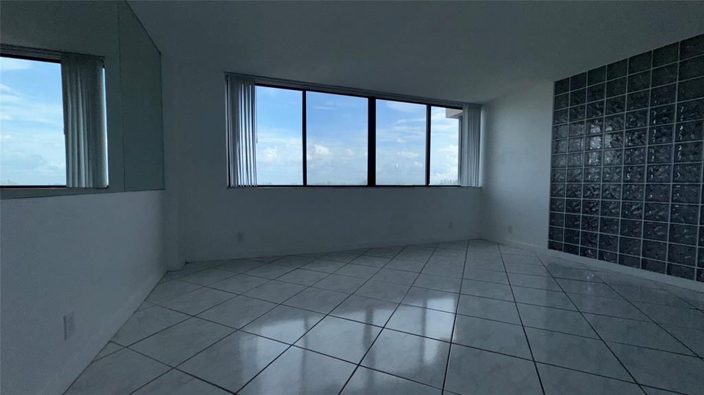 4222 Inverrary Boulevard, Unit 4711 Lauderhill, FL 33319 - Photo 6 of 11 a view of an empty room with a window