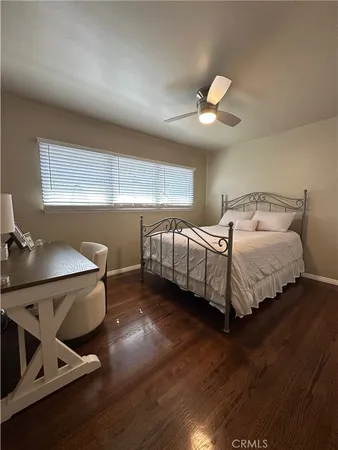 a bedroom with bed and window