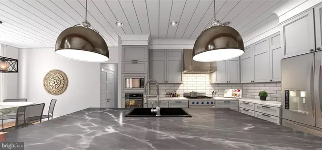 a kitchen with a stove a refrigerator and cabinets