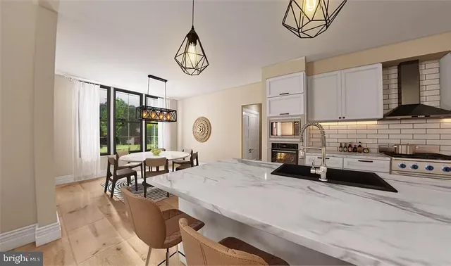 a living room with furniture a fireplace furniture and a large window