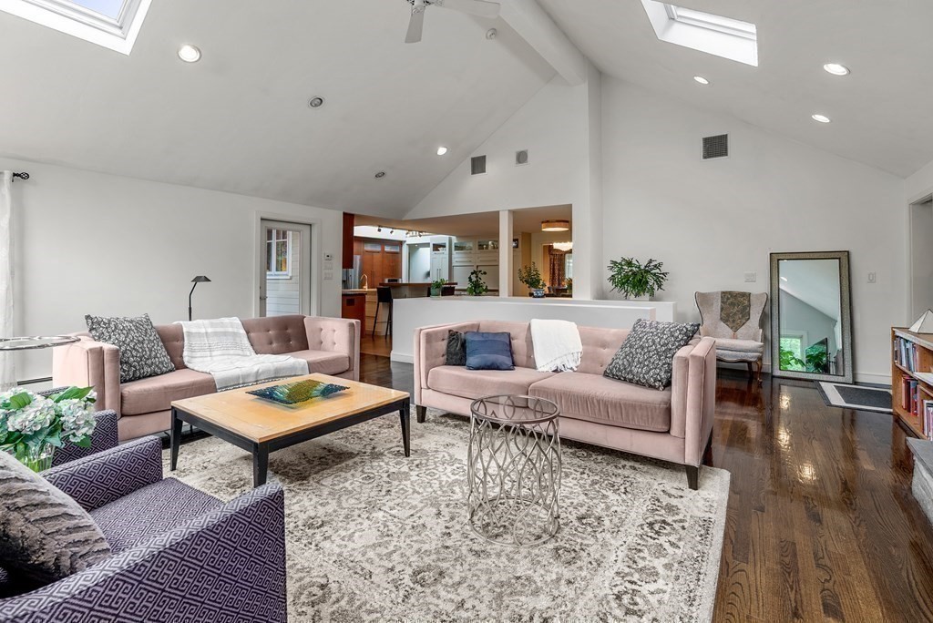 328 Dover Road Westwood, MA 02090 - Photo 12 of 41 a living room with furniture a rug and a fireplace