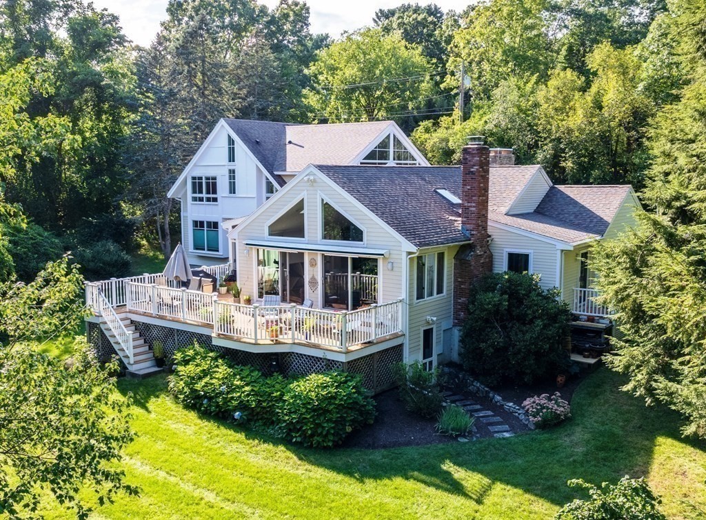 328 Dover Road Westwood, MA 02090 - Photo 2 of 41 a front view of a house with a yard table and chairs