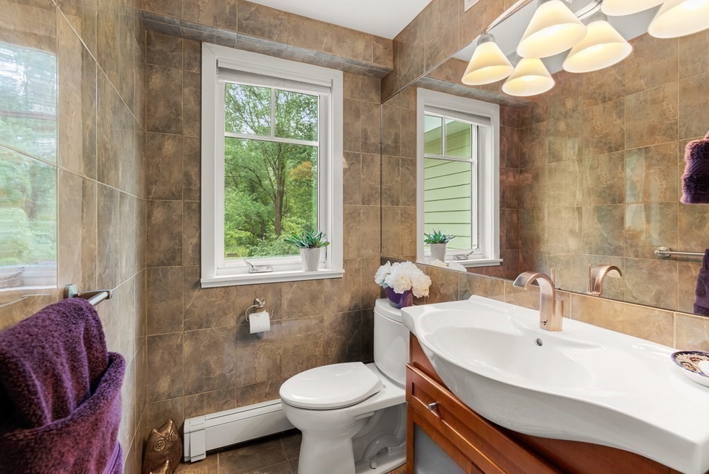 328 Dover Road Westwood, MA 02090 - Photo 25 of 41 a bathroom with a sink a toilet and a mirror