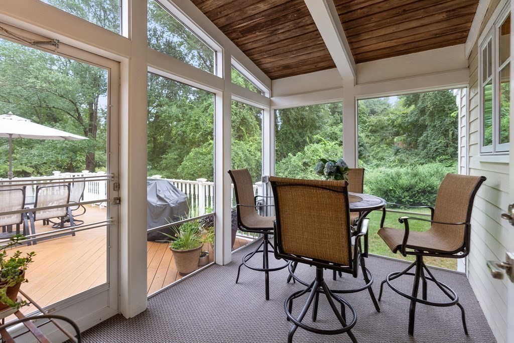 328 Dover Road Westwood, MA 02090 - Photo 29 of 41 a view of a chairs and table in the patio and a yard