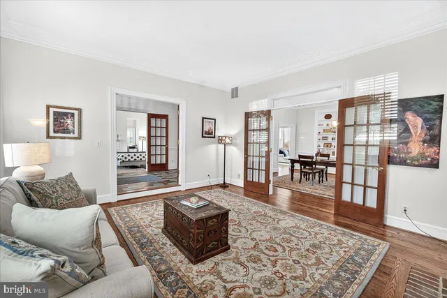a living room with fireplace furniture and a flat screen tv