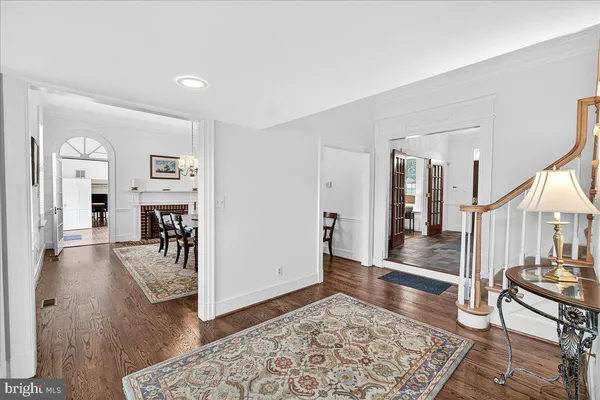 a living room with furniture flat screen tv and a large window