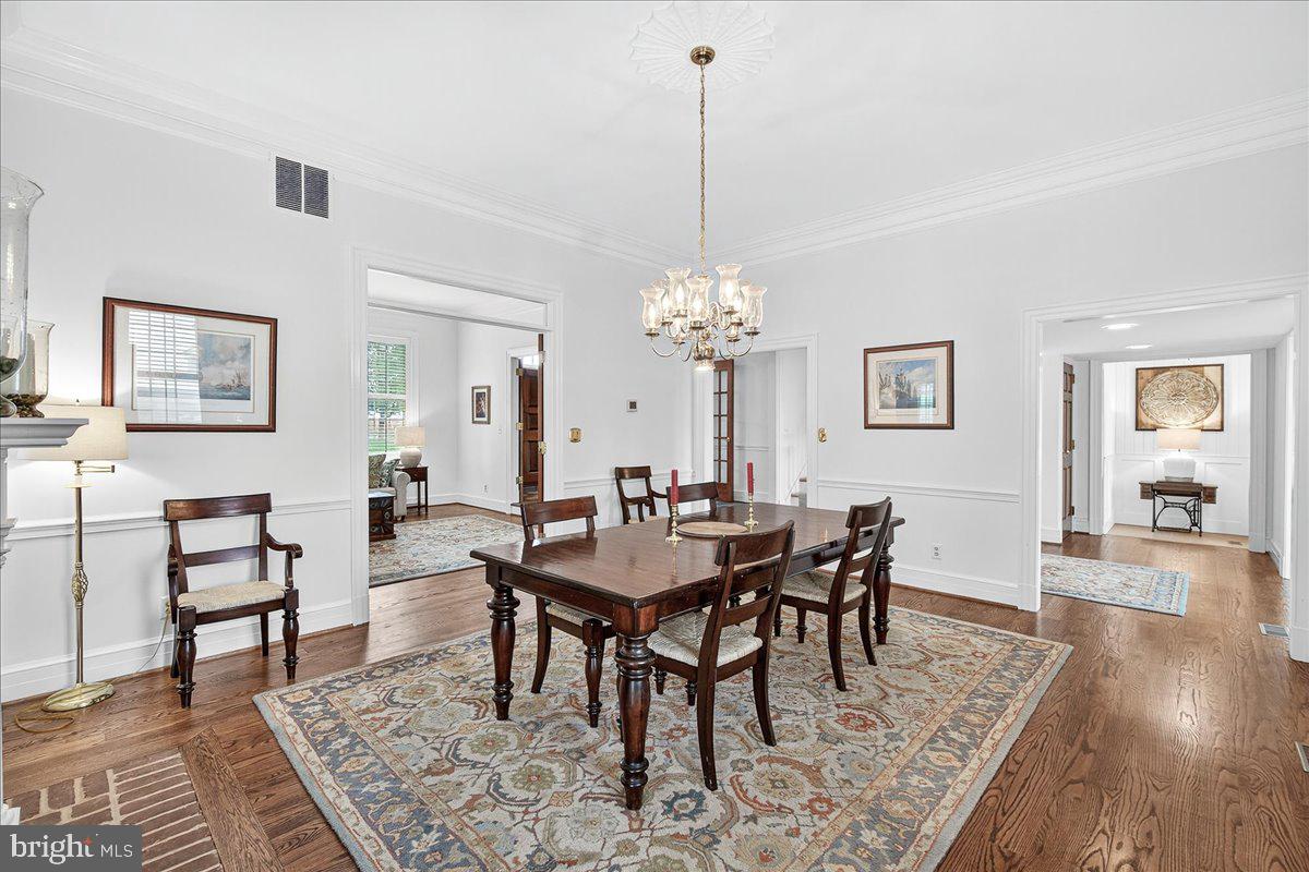 9522 Bessie Clemson Road Union Bridge, MD 21791 - Photo 17 of 107 a view of a dining room and livingroom with furniture wooden floor a rug and a chandelier