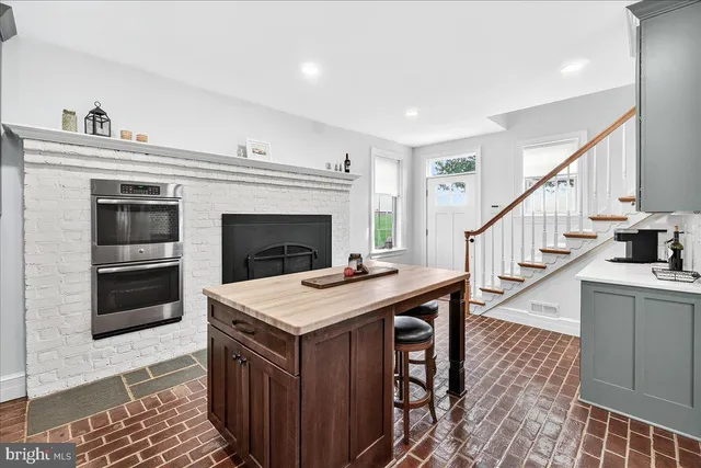 a bathroom with a double vanity sink a mirror and a shower