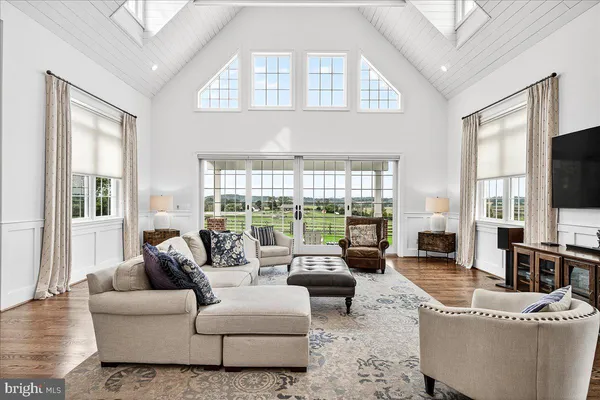 a bedroom with a bed a dresser and a window