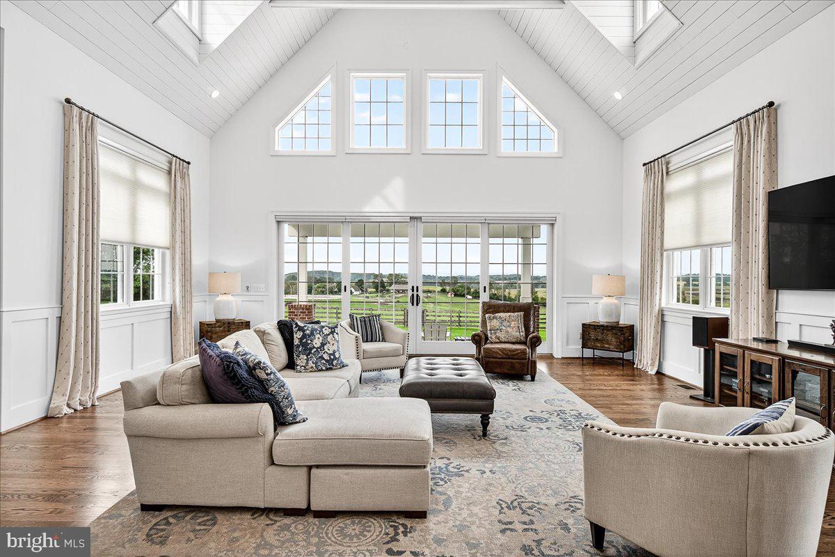 9522 Bessie Clemson Road Union Bridge, MD 21791 - Photo 26 of 107 a living room with fireplace furniture and a flat screen tv