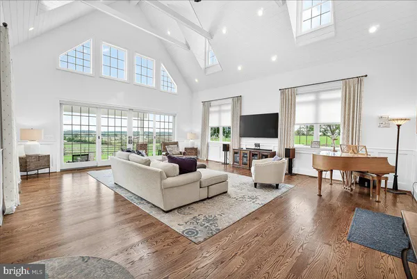 a bathroom with a toilet and a shower curtain