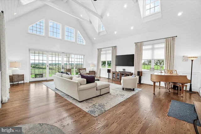 a bathroom with a toilet and a shower curtain