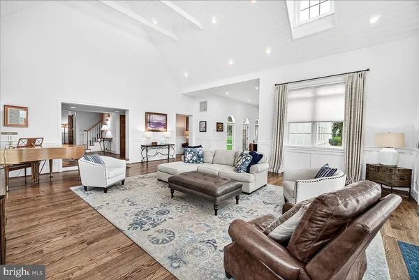 a bedroom with a bed a dresser and a book shelf