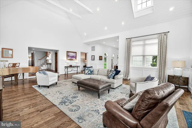 a bedroom with a bed a dresser and a book shelf